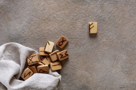 Close-up photo of Runes, Fortune telling, magic symbols. Wooden handmade, scandinavian ancient alphabet