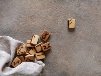 Close-up photo of Runes, Fortune telling, magic symbols. Wooden handmade, scandinavian ancient alphabet